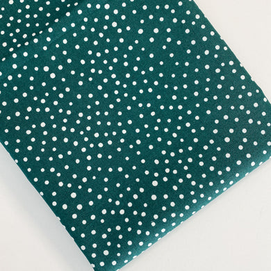 Happiest Dots from RJR Studio feature classic white polka dot prints on a backdrop of modern hues. Sold at globalfibershop.com.