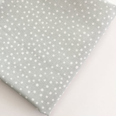 Close up of Happiest Dots in Spring Fog from RJR Fabrics. Happies Dots features organic white polka prints on a background of modern colors.