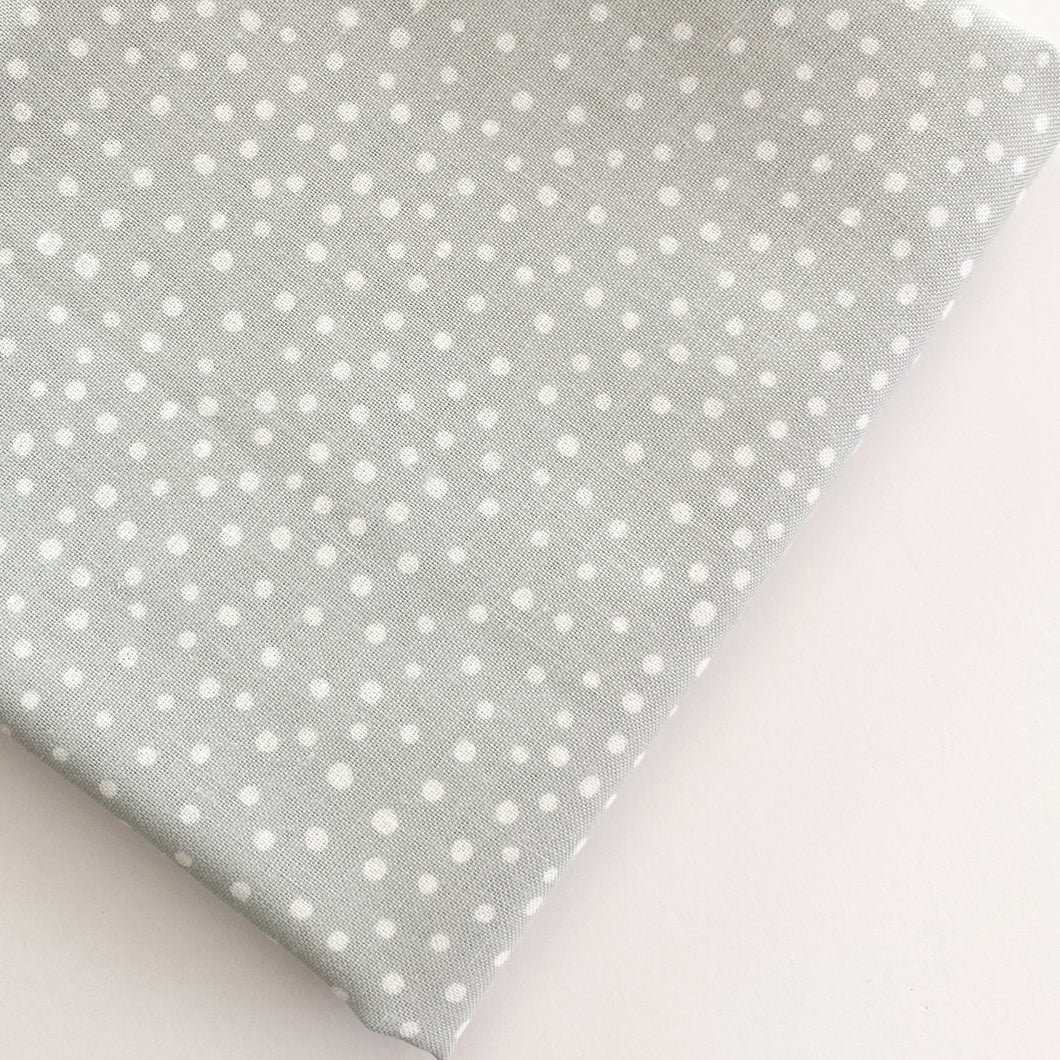 Close up of Happiest Dots in Spring Fog from RJR Fabrics. Happies Dots features organic white polka prints on a background of modern colors.