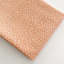 Load image into Gallery viewer, Close up of Happiest Dots in Summer Coral from RJR Fabrics. Happies Dots features organic white polka prints on a background of modern colors.
