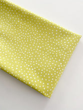 Load image into Gallery viewer, Close up of Happiest Dots in Mellow Lime from RJR Fabrics. Happies Dots features organic white polka prints on a background of modern colors.
