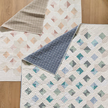 Load image into Gallery viewer, Glitter and Glow Quilt by Suzy Quilts at Global Fiber Shop in creamy, scrappy, low-volume prints. Choose warm or cool.

