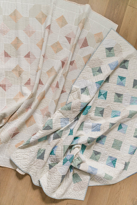 Glitter and Glow Quilt by Suzy Quilts at Global Fiber Shop in creamy, scrappy, low-volume prints.  Choose warm or cool. 