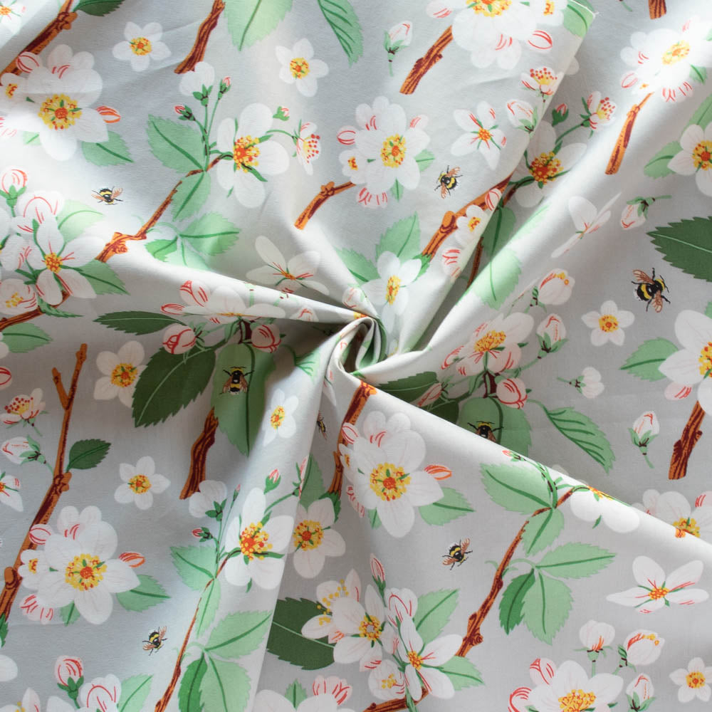 Gander the trees that produce the most beautiful of blooms, attracting lovely birds, butterflies, and bees to drink nectar, play in pollen, and seek shelter in their branches. Flowering trees features 13 prints on undyed organic cotton poplin. Sold at globalfibershop.com