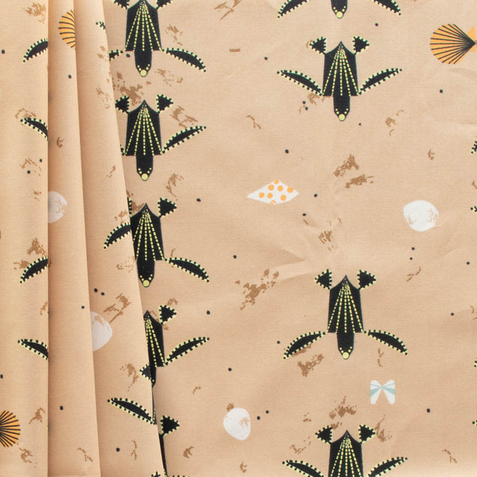 Turtles trek past a beach with shells printed on 100% GOT certified organic cotton poplin for Birch Fabrics.