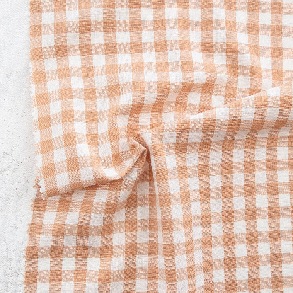 Camp Ginghams collection brings forth a classic woven style in gorgeous colors, reminiscent of retro camp uniforms. Think Moonrise Kingdom meets classic gingham! Camp Gingham is offering two sizes of yarn-dyed cotton gingham 3/8″ and 2.25″. Each size has a multitude of purposes from quilts, to apparel, to table settings! Sold at globalfibershop.com.