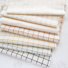 Load image into Gallery viewer, Introducing Trellis Wovens!  Trellis Wovens from Fableism Supply Co features a 1&quot; grid in a selection of earthy tones on a cream background.  The Trellis Wovens grid is small enough for piecing and perfect for quilt backs and garments.

