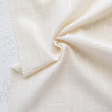 Load image into Gallery viewer, Introducing Trellis Wovens!  Trellis Wovens from Fableism Supply Co features a 1&quot; grid in a selection of earthy tones on a cream background.  The Trellis Wovens grid is small enough for piecing and perfect for quilt backs and garments.
